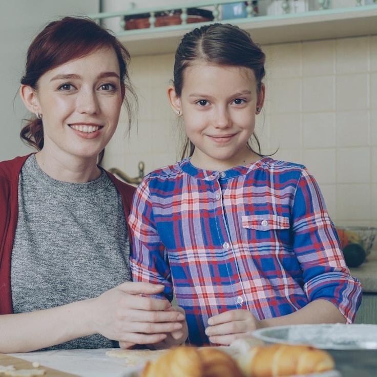 Avery Lin, Lead Design Curator at SundryFieldTone, reviewing corporate floral arrangements